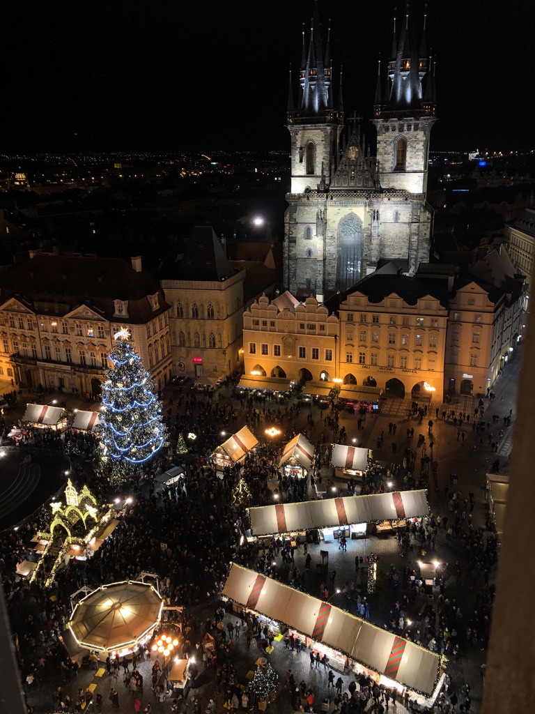 Prague’s Old Town Square and Christmas market illuminated at night.