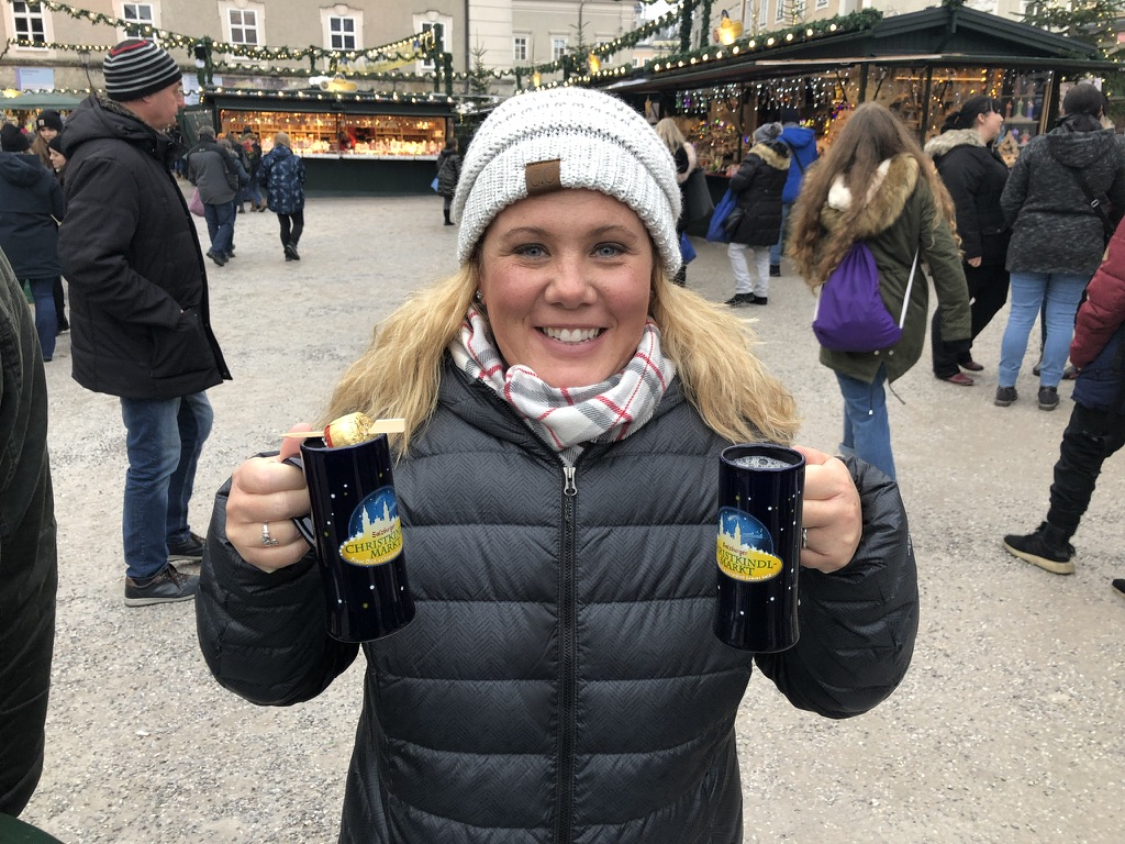 A festive photo stop with Salzburg Christmas-market mugs.