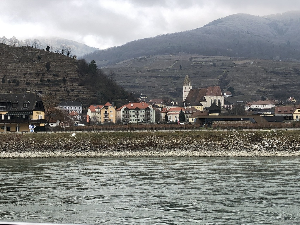 A riverside village beneath winter vineyards in the Wachau Valley.