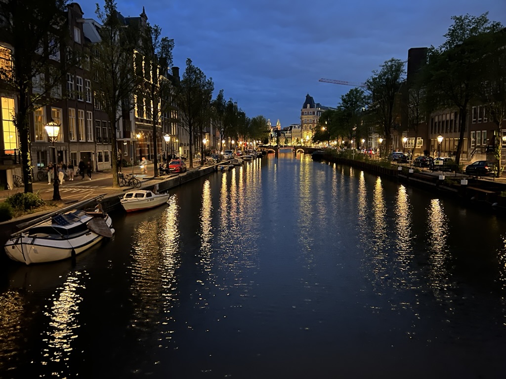 Amsterdam’s canal lights after dark.