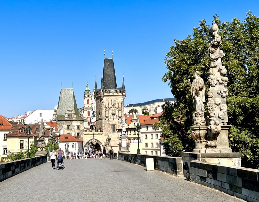 Statues and towers along Charles Bridge in Prague.