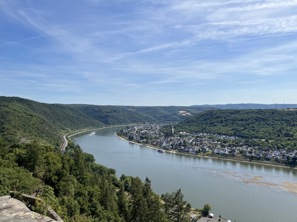 A sweeping river view, with exposed gravel bars visible beside the channel.