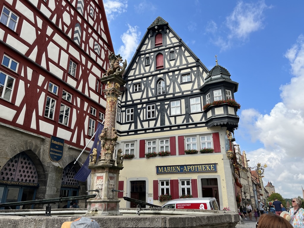 Half-timbered buildings and a fountain in Rothenburg ob der Tauber.