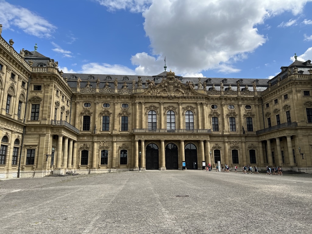 The broad courtyard and ornate facade of the Würzburg Residence.