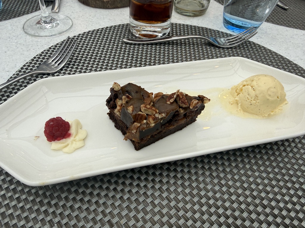Chocolate dessert with ice cream and a raspberry served aboard the ship